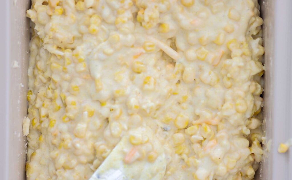 image of cheesy corn souffle filling before oven